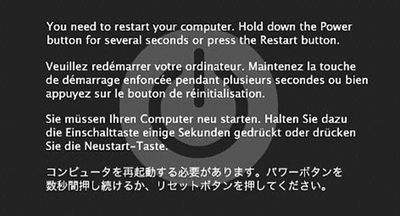 Panika jádra systému Mac OS.  V závislosti na verzi systému Mac OS může mít panický obrázek černé nebo šedé pozadí.