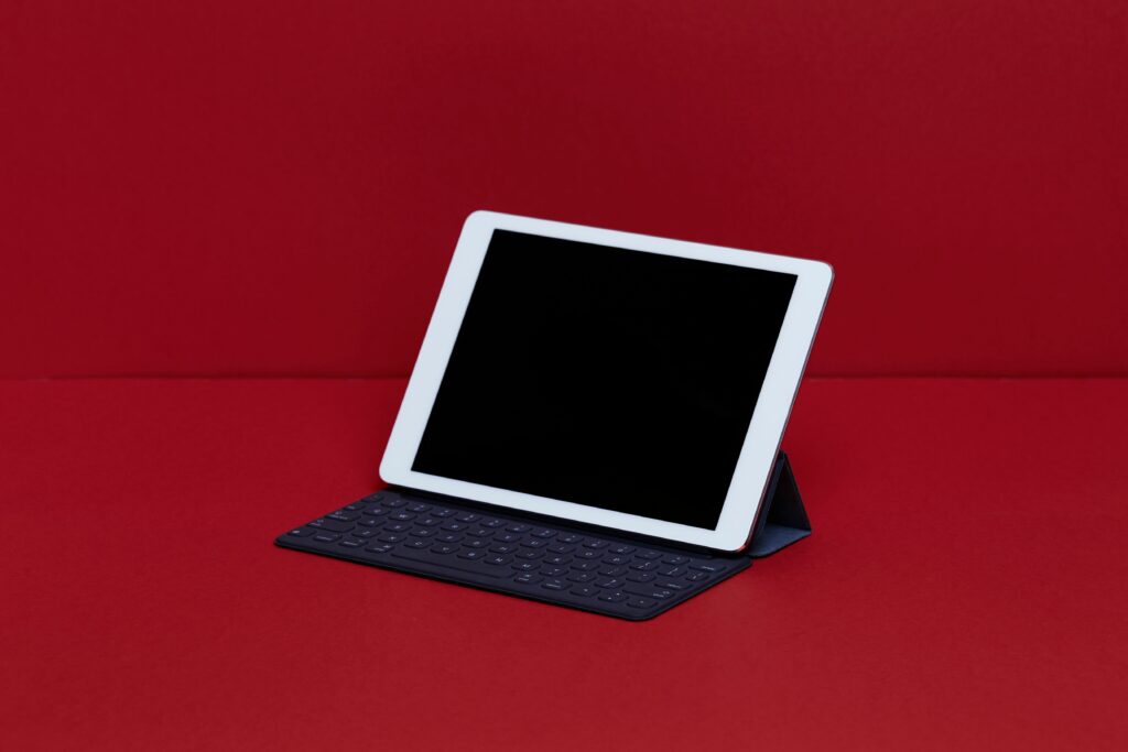 close up of digital tablet with keyboard on red table 910893214 5c64aa3d46e0fb0001dcd881