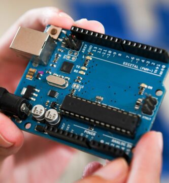 close up of male hands holding an arduino microcontroller board 640998456 5bd360ffc9e77c00261958a9