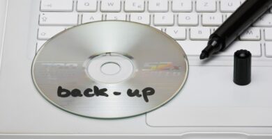 detail of a back up disc and a marker on a laptop 101883221 5b9f80c1c9e77c002cd5aa91
