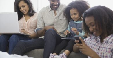 family using wireless devices at home 468774723 5a52b68a9e942700378ddbf8
