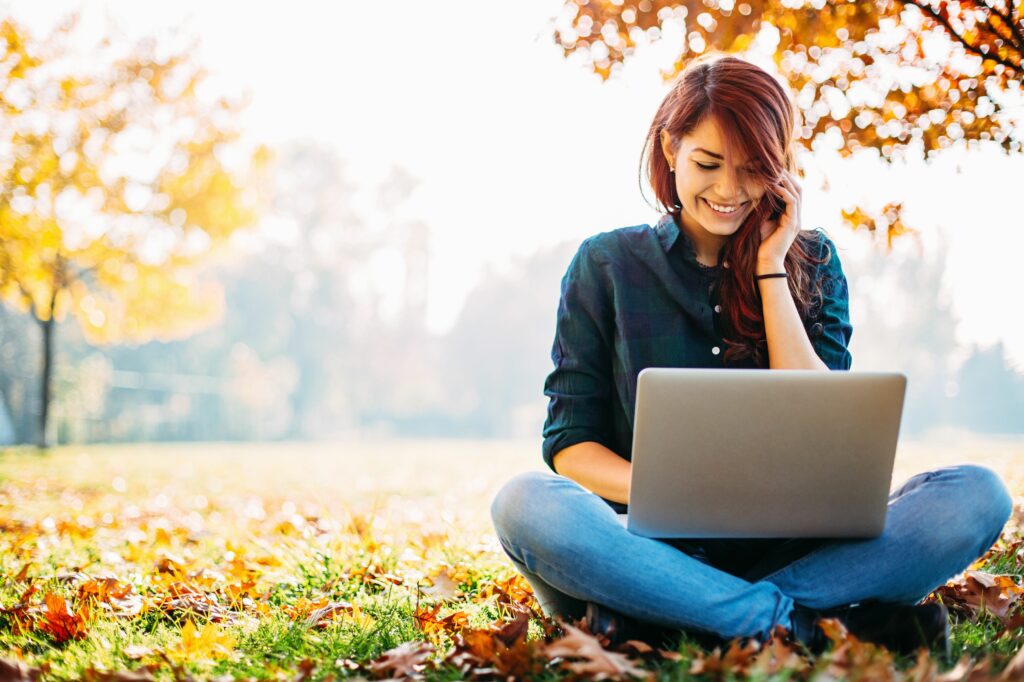 girl with computer during fall 495908462 5b71a54dc9e77c0082db32f8