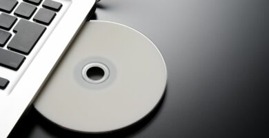 inserting a blank cd into a laptop with copy space 183334872 57c368ca3df78cc16eb343cb