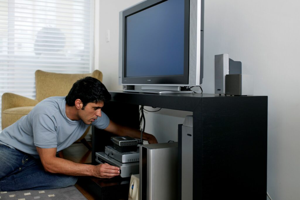 mid adult man fixing television cable side view 200552576 004 57eee47e5f9b586c358835ac 75fabb51c6894aeea0604a948daa7da4