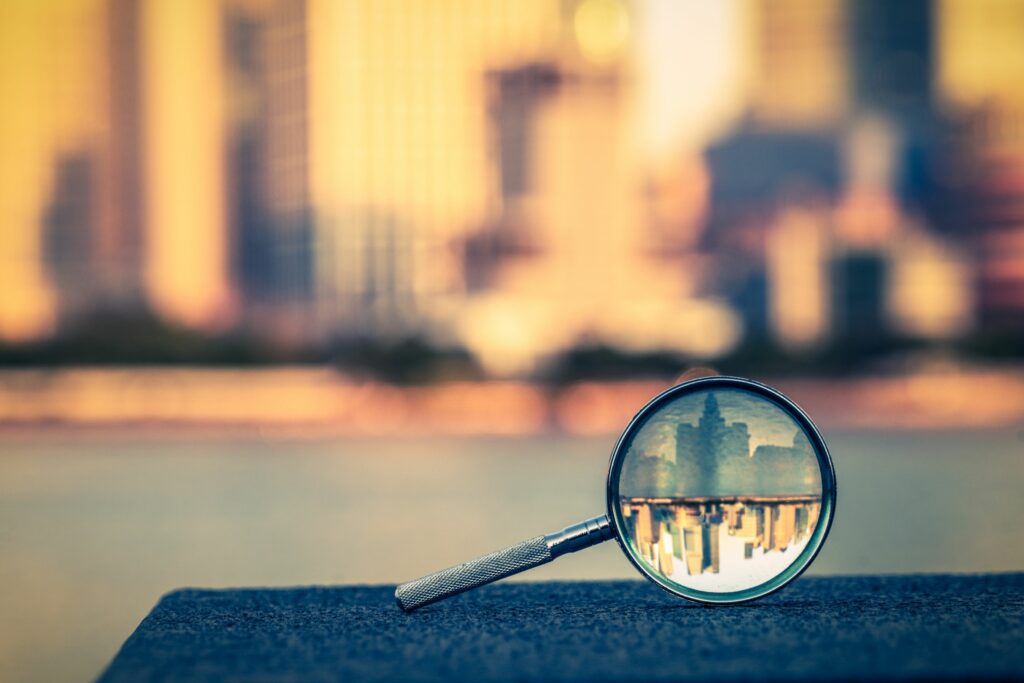 the bund of shanghai reflected in a magnifying glass 657283468 5a2f09be98020700374eaa1b
