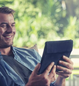 young man listening to music with a digital tablet 504222904 5b27623e119fa80036547693