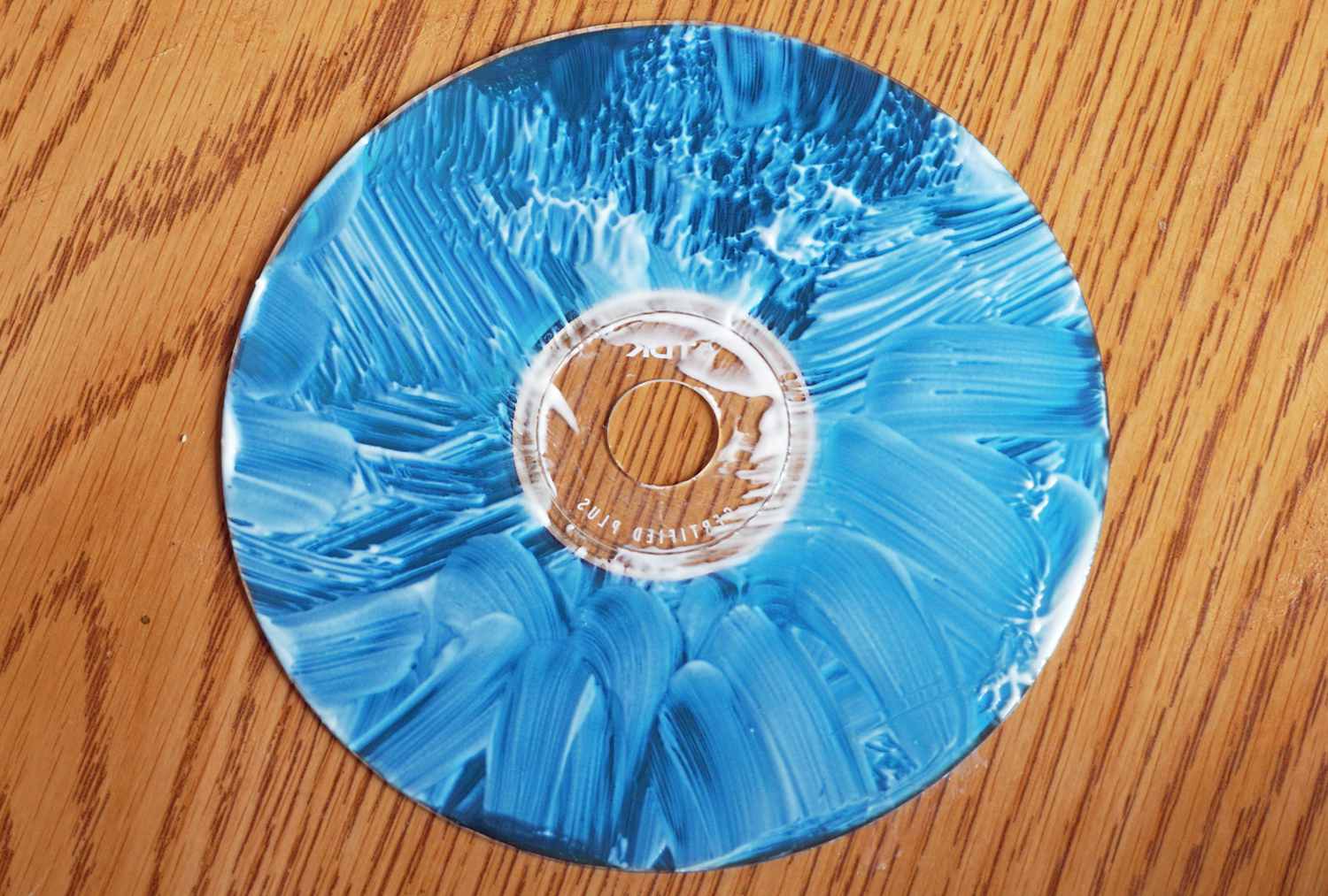 Scratched CD Covered in Polish