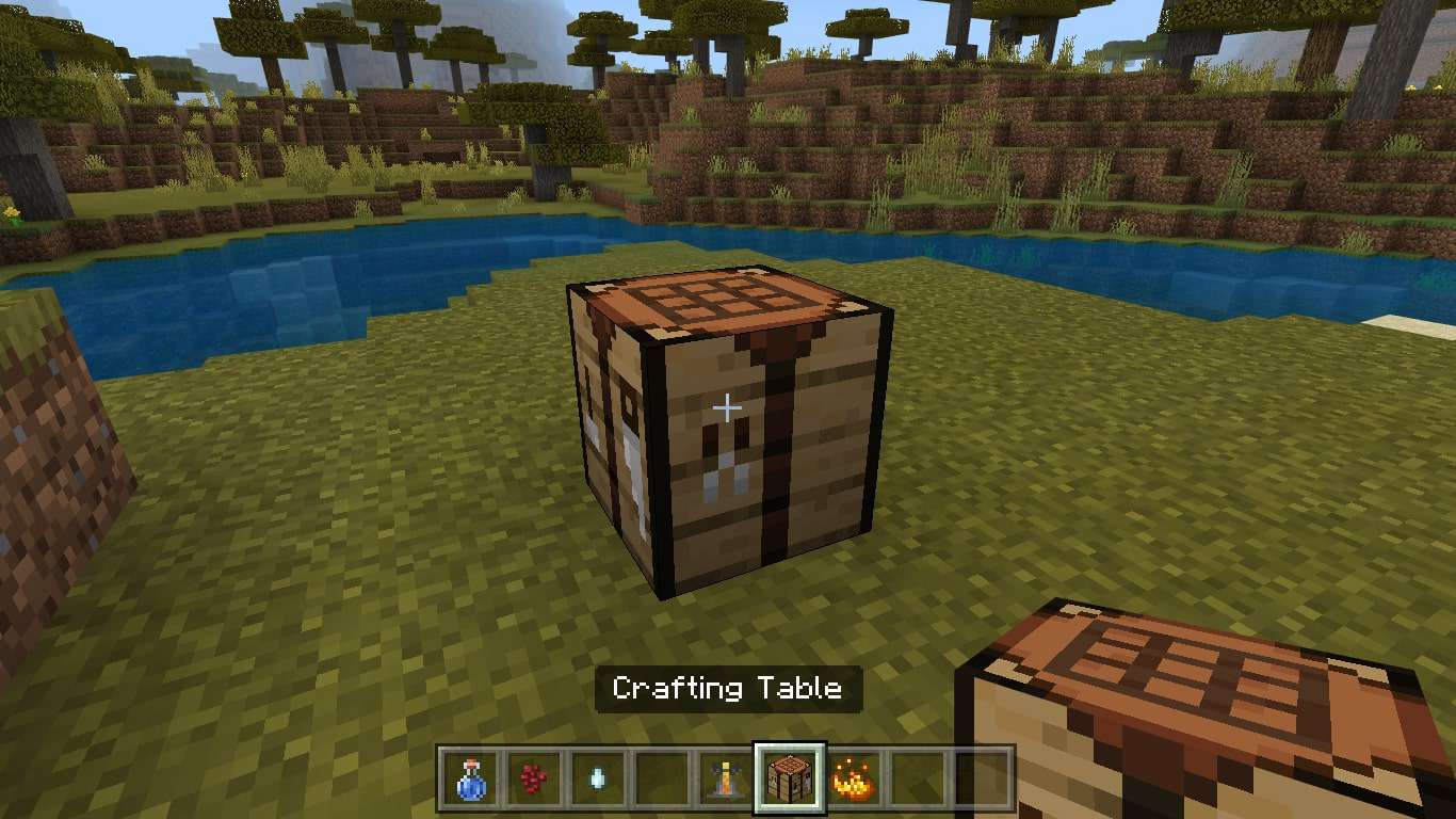 Položte Crafting Table na zem a otevřete jej, aby se vytvořila mřížka 3X3.