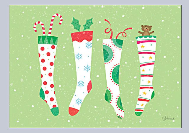 Barevné punčochy na zeleném pozadí v bezplatné vánoční pohlednici
