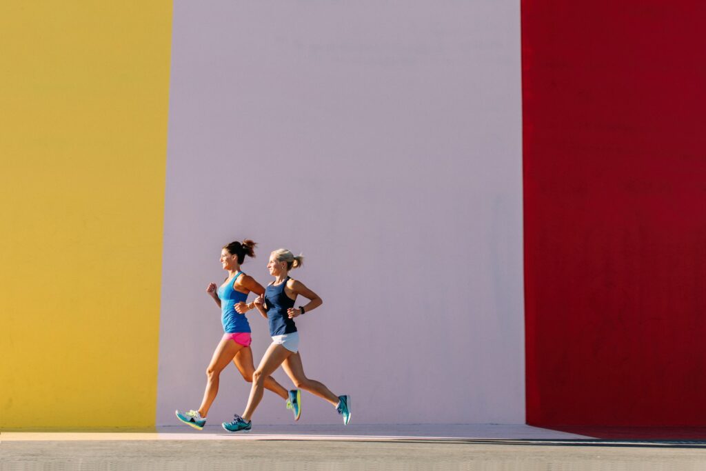 Womenrunningagainstcolorfulwall 5f0af0ecdcda4b4a8aeb8f66af715747