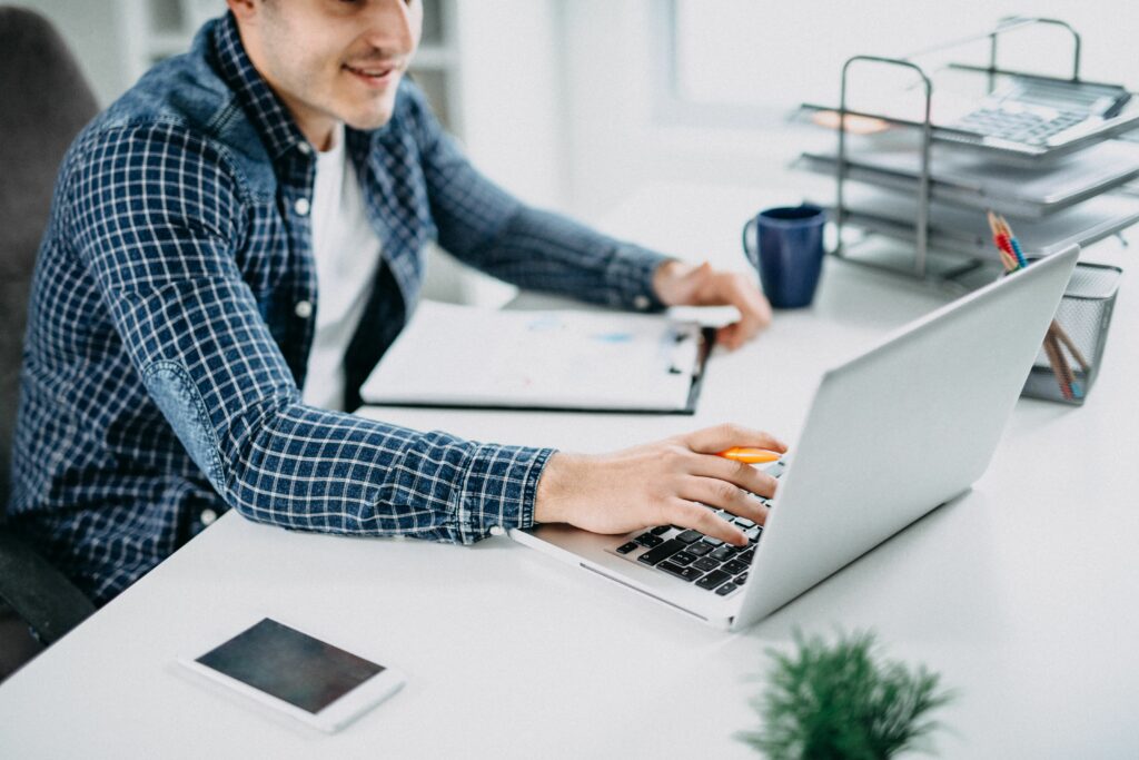 business person reading data on paper charts and computer 873053862 5be5c8f046e0fb00514ad8a5