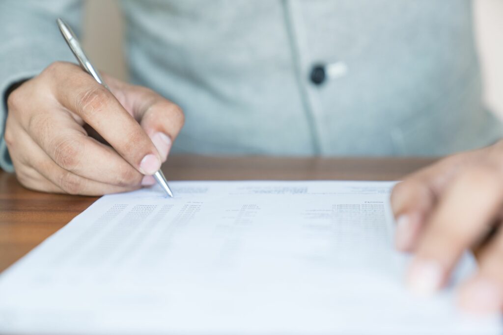 businessman signing documents 801881744 5c02d00246e0fb000196776c