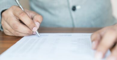 businessman signing documents 801881744 5c02d00246e0fb000196776c