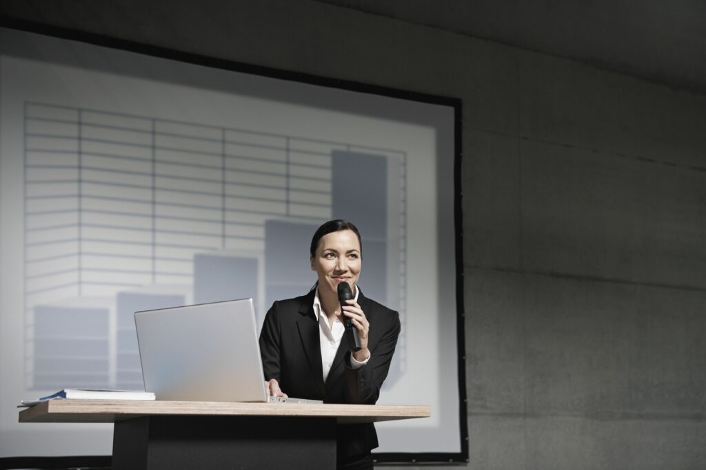 businesswoman giving a presentation 523428166 593093145f9b589eb486d736 5c4e159a46e0fb00014c36d2