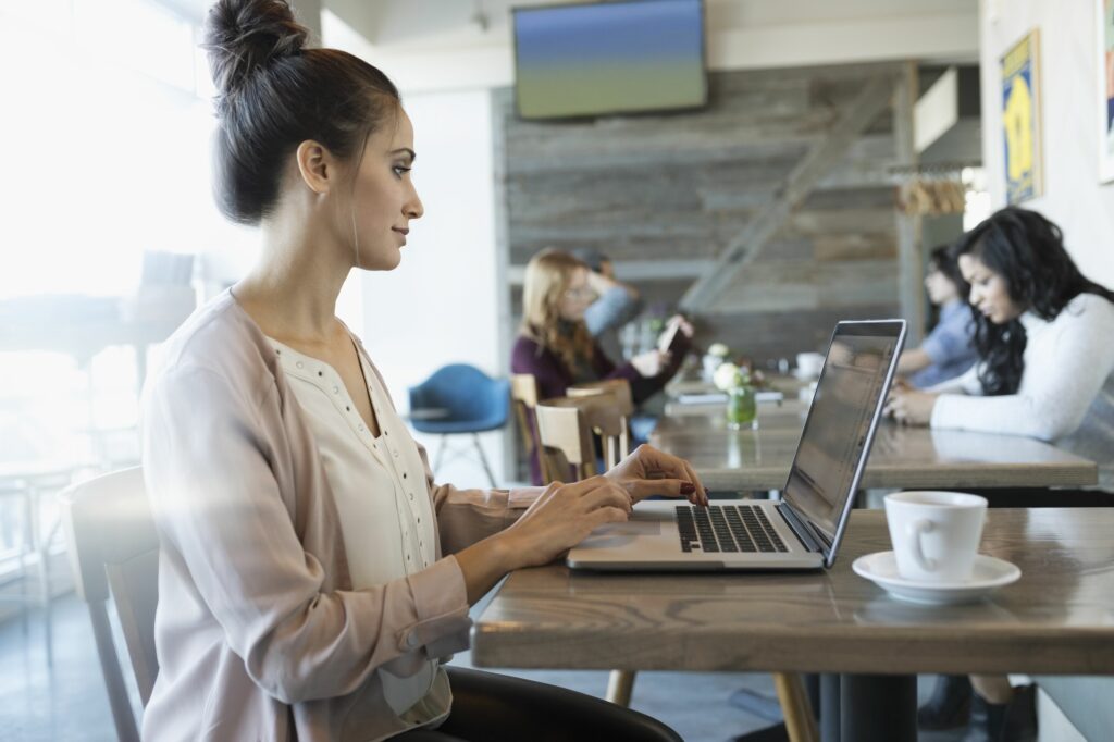 businesswoman working at laptop in cafe 956747198 5af9a488642dca00370fa646