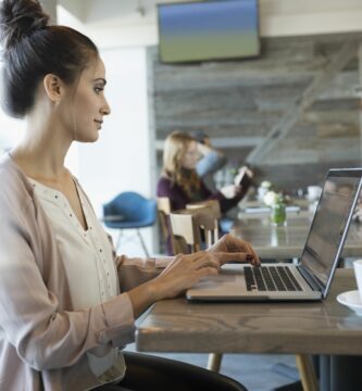 businesswoman working at laptop in cafe 956747198 5af9a488642dca00370fa646