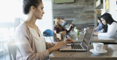 businesswoman working at laptop in cafe 956747198 5af9a488642dca00370fa646