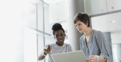 businesswomen with laptop working in office building 175138289 5a8de11204d1cf0036f74e20