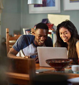 couple laughing at footage on laptop at breakfast 652553835 5a3a81104e46ba00361b8d2e 0e183f3ad8a9414e9f0586b5fe20bb26