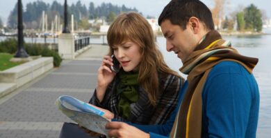 couple reading map on waterfront young woman using mobile phone 200326285 001 5a948525119fa80036dc10c9