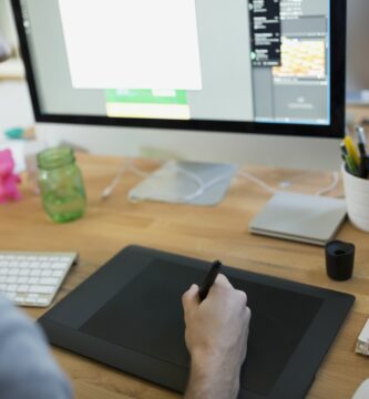 designer using graphics tablet at computer 645426203 5a4be2a2482c520036546b78