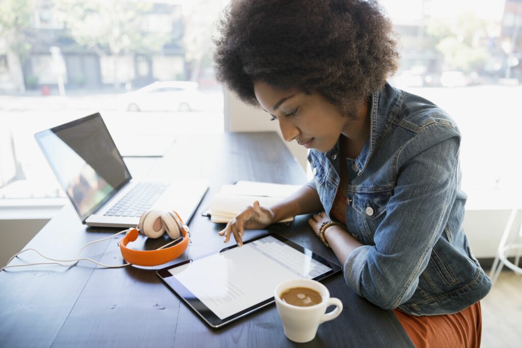 focused woman working at digital tablet in cafe 678401189 589872023df78caebc2709b1