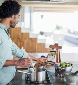 man cooking using a tablet for recipes 483963425 5b5de0aa46e0fb0050baec8d