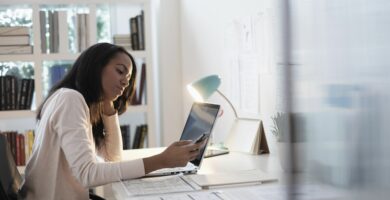 mixed race businesswoman using cell phone 606353283 5b216086eb97de0036cb09f3