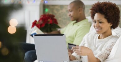 mixed race woman buying christmas presents online with credit card 84527986 582352235f9b58d5b1ea09cc
