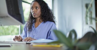 mixed race woman typing on computer 114849804 574a210e5f9b5851653146b9