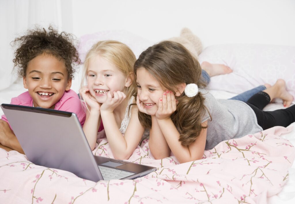 multi ethnic girls looking at laptop 80284210 5978c122845b340011a57b9b