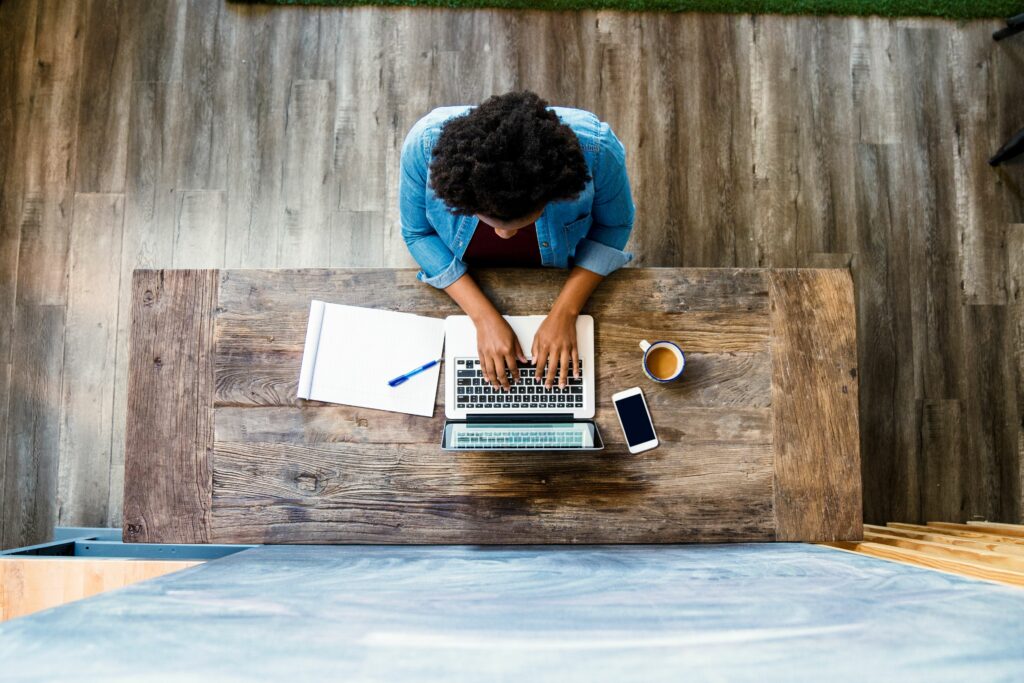 overhead view of a woman using a computer 626172712 5b4a789146e0fb00375d2205