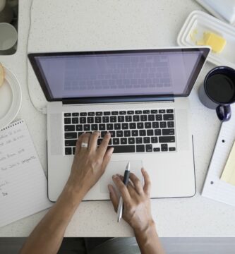 overhead view woman working at laptop at breakfast kitchen counter 753288519 ce50b21824f540b2a84b269d16d21140