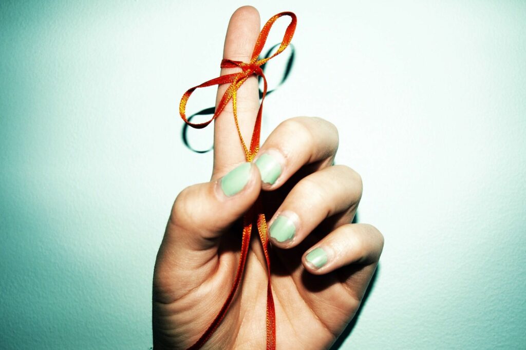 reminder ribbon tied to finger 125529676 5a0b12e289eacc0037a09e7c 5c634d4446e0fb0001106647