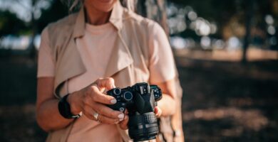 senior woman using camera and looking at photos in nature 979294778 5c0a9ea6c9e77c0001eb82a6