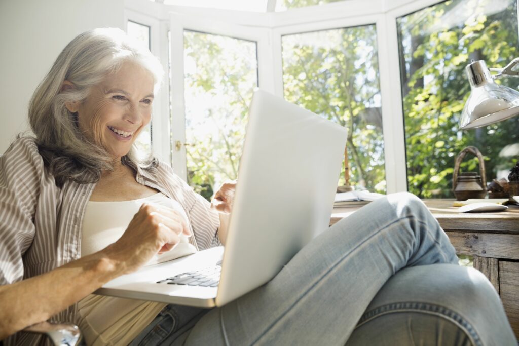 senior woman using laptop in sunny home office 530053781 5a3aab640c1a82003643d1df