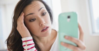 stressed woman using cell phone 649660615 5c5355e34cedfd0001efd4cb