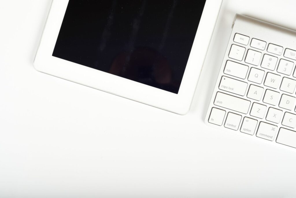 tablet on white office desk with computer keyboard and copy space 672288286 5c64987c46e0fb000184a4f6
