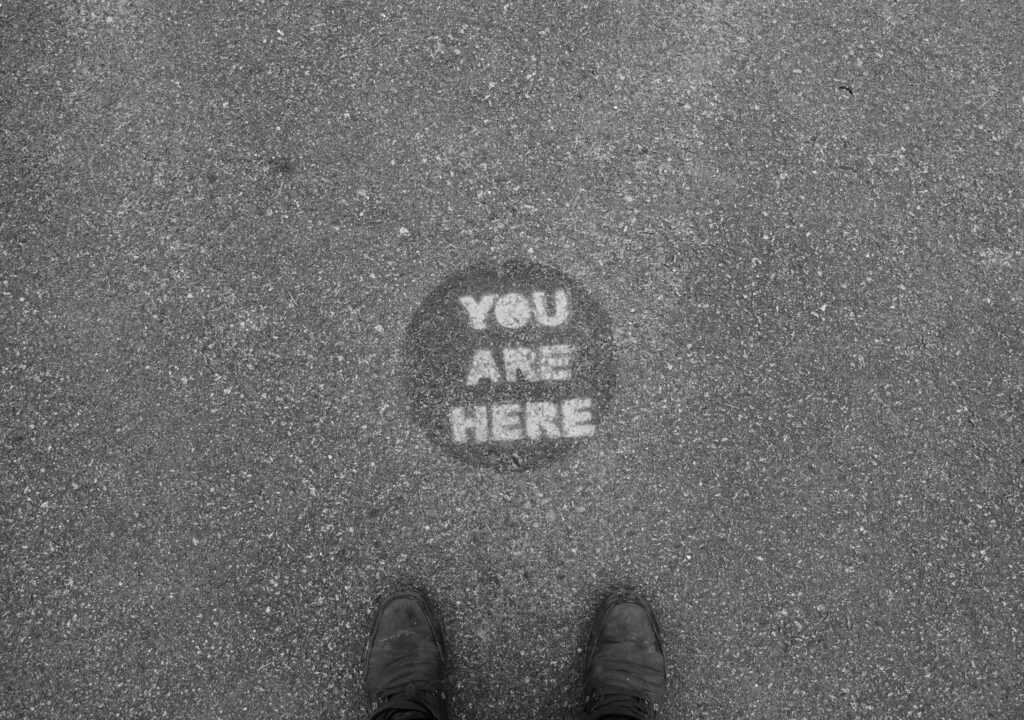 you are here marker on street road 562395365 5a52da504e46ba003626743d