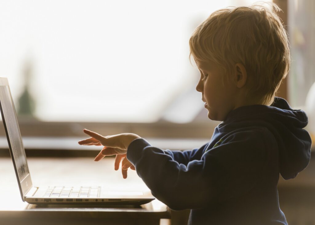 young schoolboy working on laptop computer 523191728 59c290b4519de200109e27f6