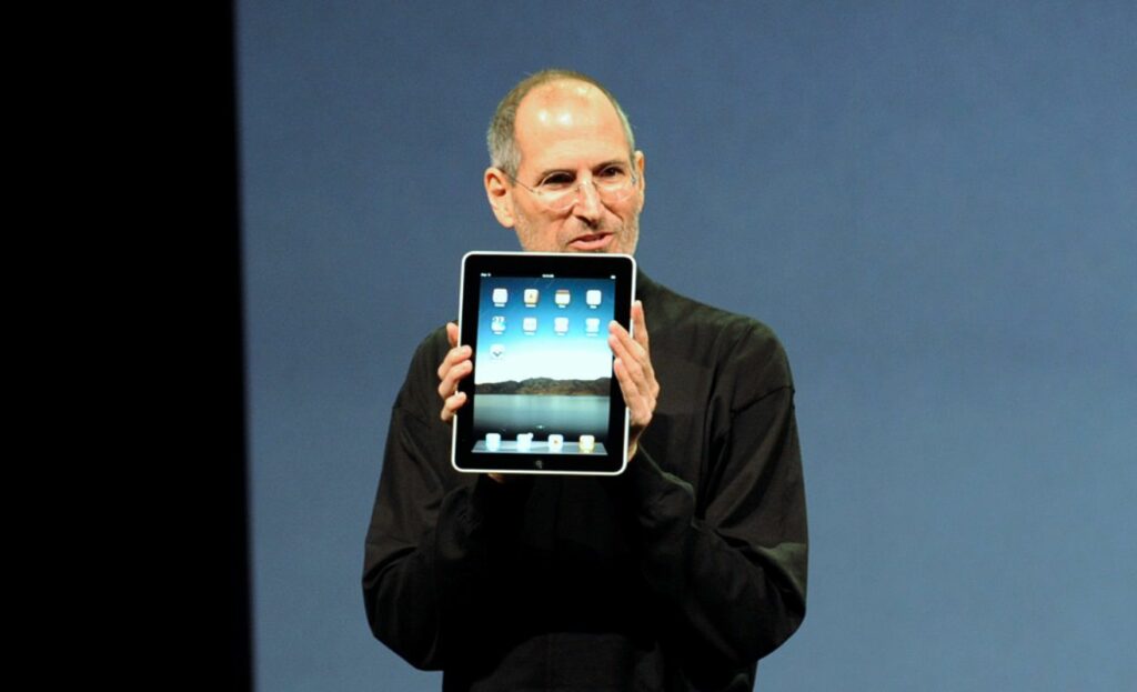 Steve Jobs with the Apple iPad 5c337cdbc9e77c0001b278aa