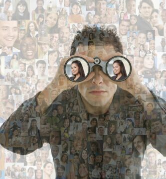 businessman looking in binoculars over montage of smiling faces 508480019 5bde603b46e0fb002663f602