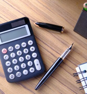 financial notebook and pen on wooden table 898648150 5be08ebfc9e77c0051722644
