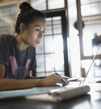 focused young woman working at laptop in office 769719673 5be9ec53c9e77c005106d18b