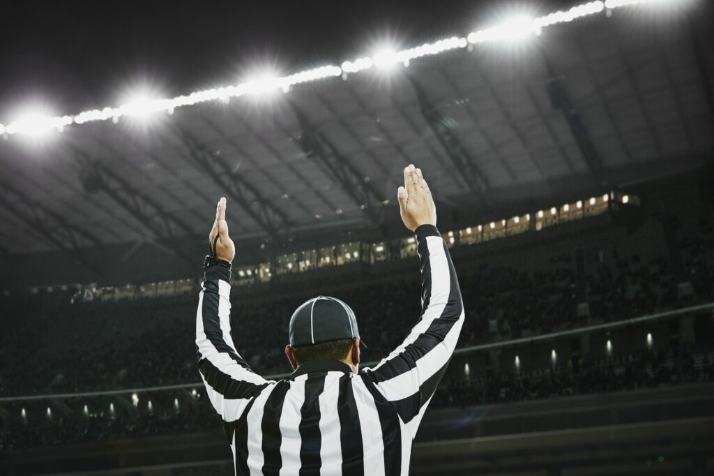 football referee signaling touchdown in stadium 599944339 5a84cb9e875db900367df025