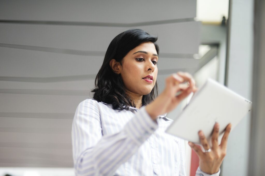 indian singaporean business woman using a tablet 454976061 5a3a9107b39d0300376a09e8