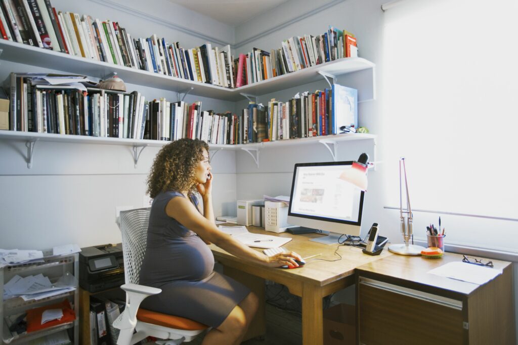 pregnant lady works from her home office 567613055 5a09ec4c494ec9003735d223