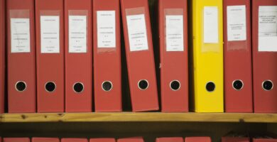 row of red work files with one yellow one 110953663 57ab2a733df78cf45974949c