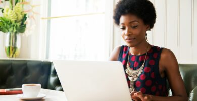 woman using laptop at table 691573537 5a3a76ce98020700379d2ff7