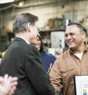 worker receiving award in workshop 649662449 5b9d4154c9e77c0050d1885a